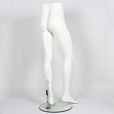 Male mannequin legs in front of a white background, side on view